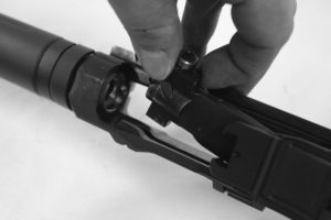 When reinstalling the bolt, angle it in such a fashion so that the left lug will slide down into its slot and the rear of the bolt clears the lower receiver lug.