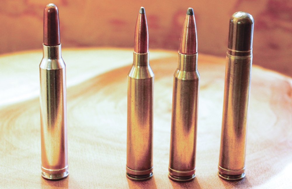 The .300 Win. Mag., left, was the fourth cartridge in a series of belted magnums designed to ﬁ t in a standard long action. The other Winchester Magnums are, from left to right, the .264, .338 and .458, all based on the .375 H&H Mag. case.