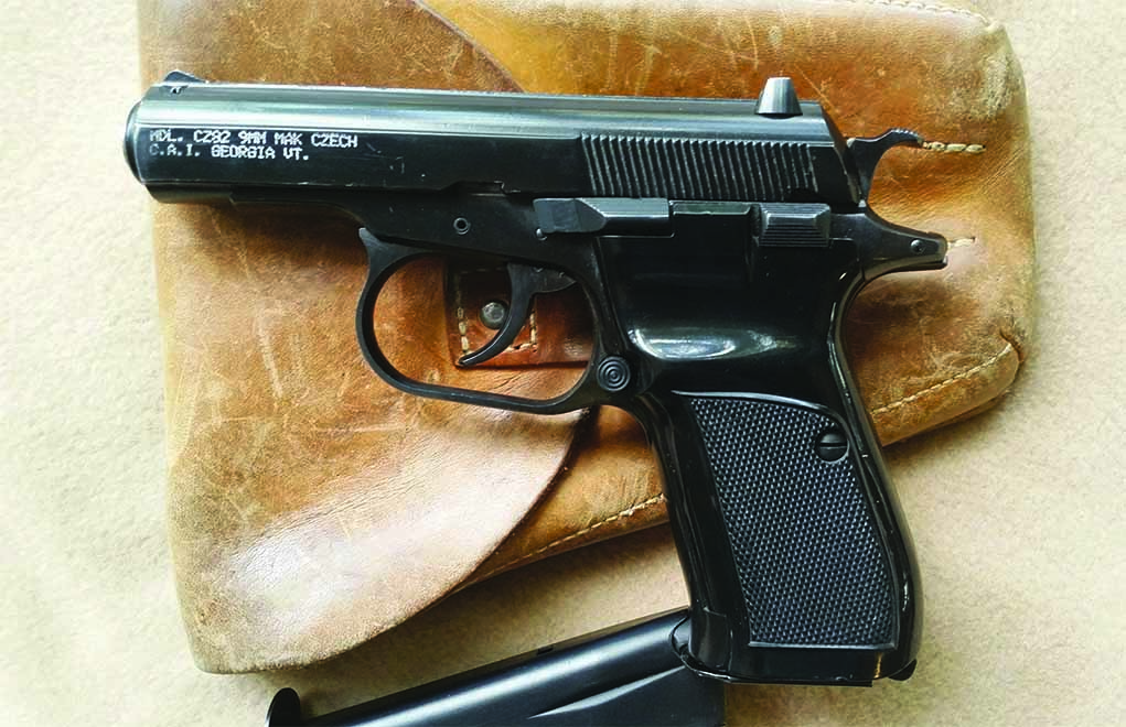 Shown with its original military holster, the Czech CZ 82 is the most advanced of all of the Soviet Bloc 9mm Makarov caliber pistols made during the Cold War. With an ambidextrous safety and magazine catch, and a 12-shot staggered magazine, it is the most highly sought after of all pistols of like caliber. Serial numbers and government ownership marks are located on right frame and slide. 