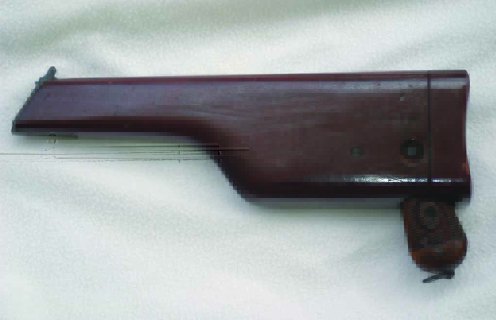 Pistol in wooden holster/case/shoulder stock.