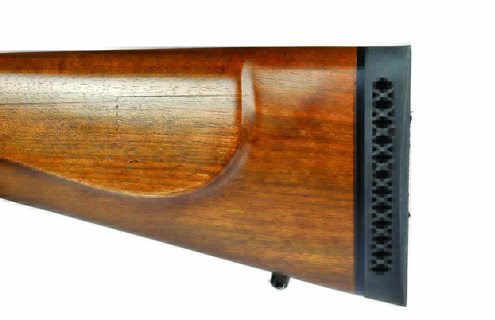 A ¾-inch recoil pad, bordered by a black spacer, is precisely fit to the stock of the rifle.
