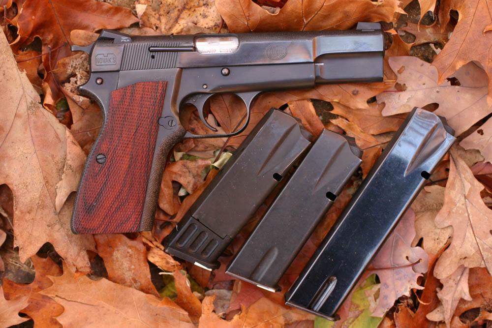 The Browning Hi Power (this is a Novak Custom) was for a long time the only hi-cap 9mm. Now they are common, but the BHP is still a valid choice for those who want a single-action system pistol.