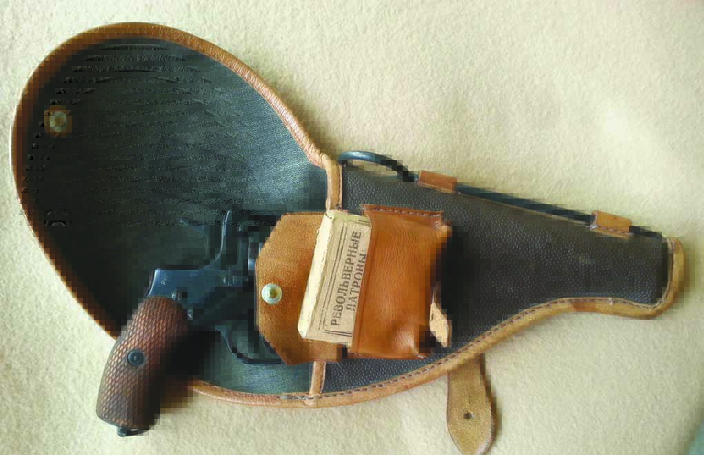 Many of these surplus revolvers are complete with holster and cleaning rod. Note the ammunition pouch that accepts standard 14-round Russian ammunition packs.