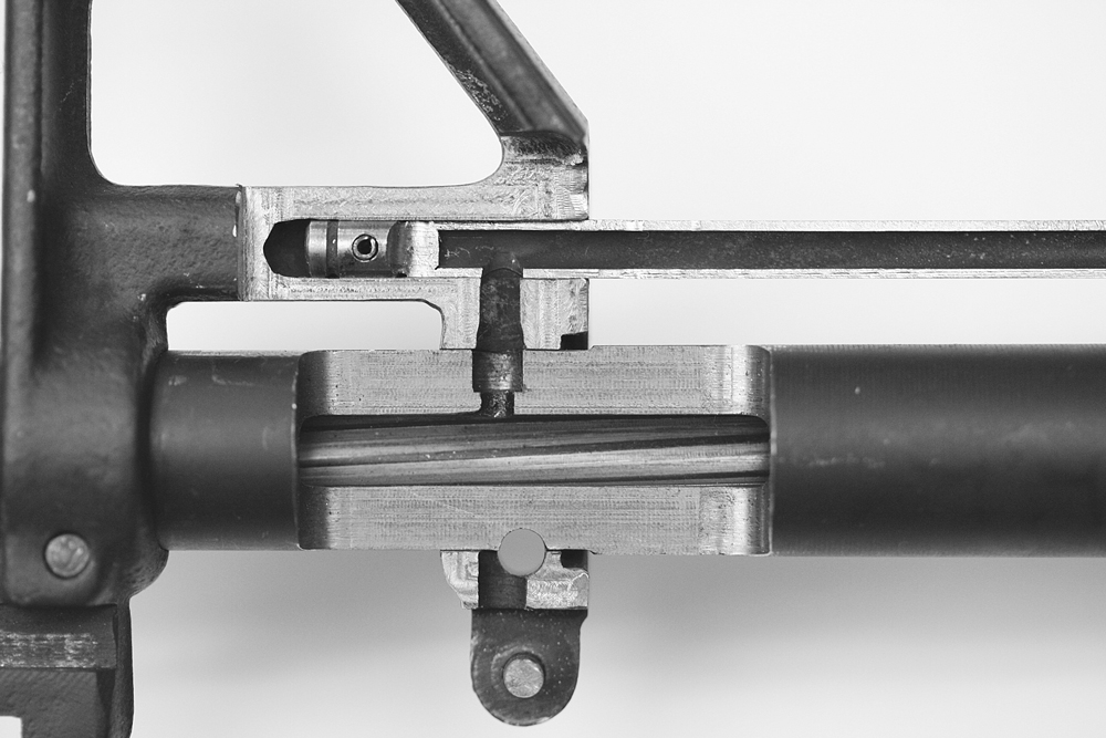 The origins of the gas flow. The gas gets vented out of the barrel, through the front sight housing, and down the tube towards the carrier key.