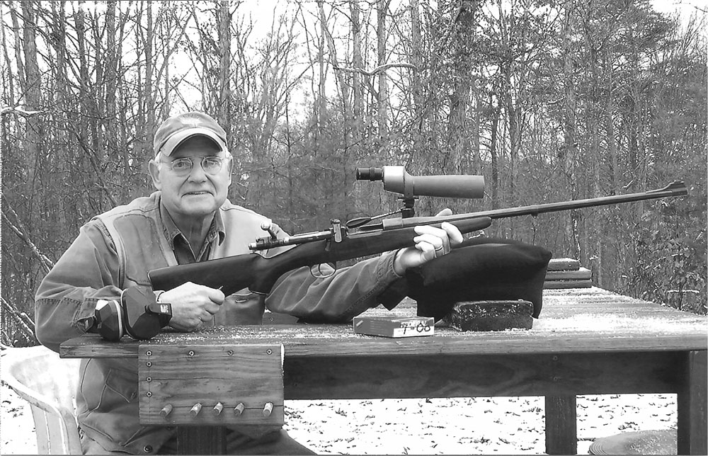 A picture of the author at his 200-yard shooting bench. He was pleased with the appearance, balance and accuracy of his converted Yugo Mauser.