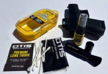 Gear Review: Otis Lens Cleaning Kit The contents of the Otis Lens Cleaning Kit spread out next to a Glock 26 on a white background.