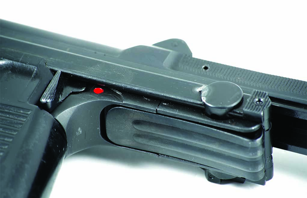 With the shoulder stock in the “closed” position, the butt plate folds up under the lower receiver. Note the bead weld at the junction where the shoulder stock and shoulder stock latch pin meet, preventing it from being opened.