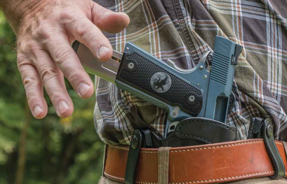 If you have to load your semi-auto pistol with one hand, secure it in your holster first. This is much safer and more secure than trying to use a body part other than your hand to hold the pistol.