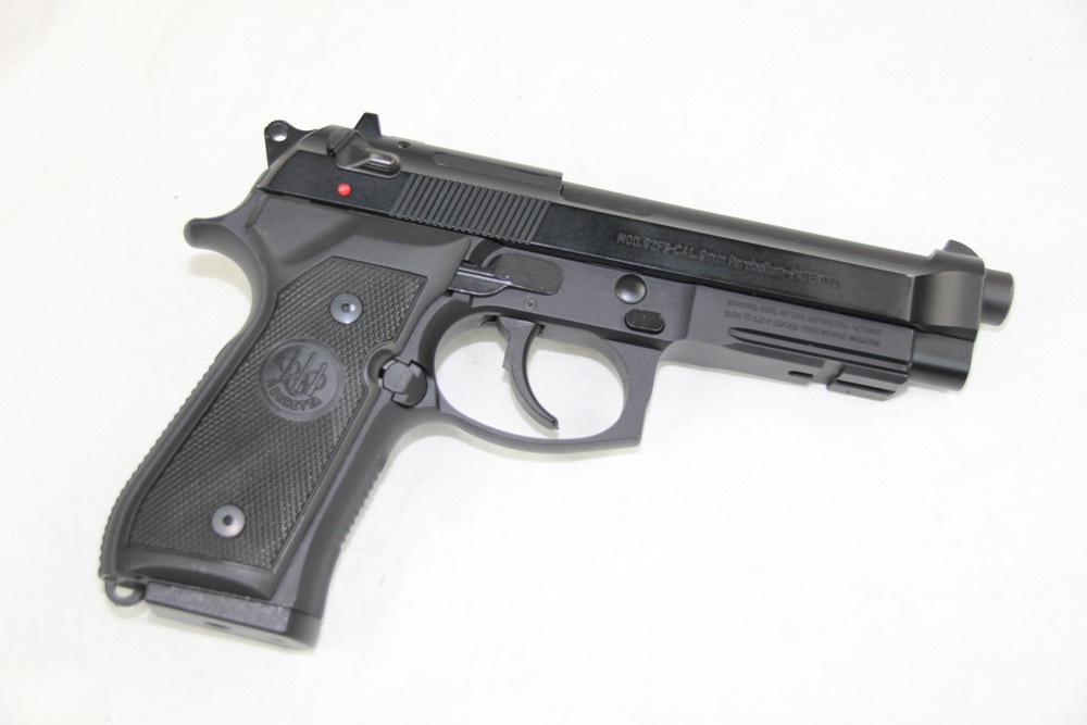 The Beretta M9A1 is an improved version that adds a Picatinny rail to the frame, high-profile three dot sights, heavy checkering, and a beveled magazine well.