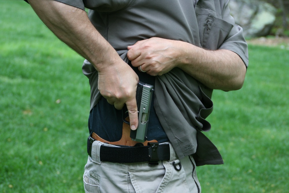 The best concealed carry holster the author used with the Kahr CM9 is a Crossbreed MiniTuck IWB (inside-the-waistband) with a forward cant.