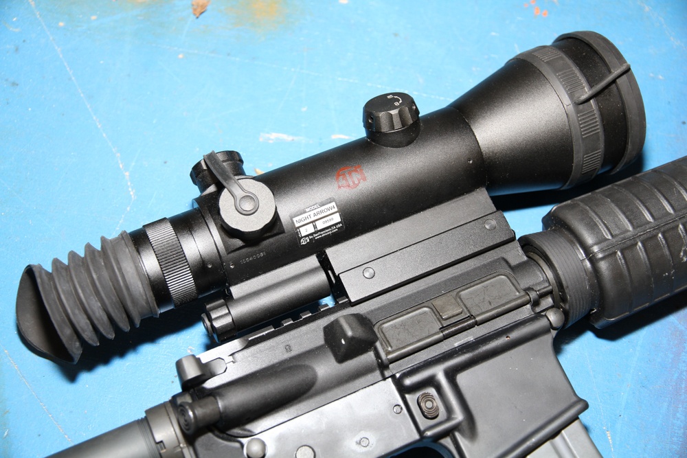 The ATN Night Arrow is an integrated night vision and optic with a built-in reticle. You only need it, not an optic and an NVG.