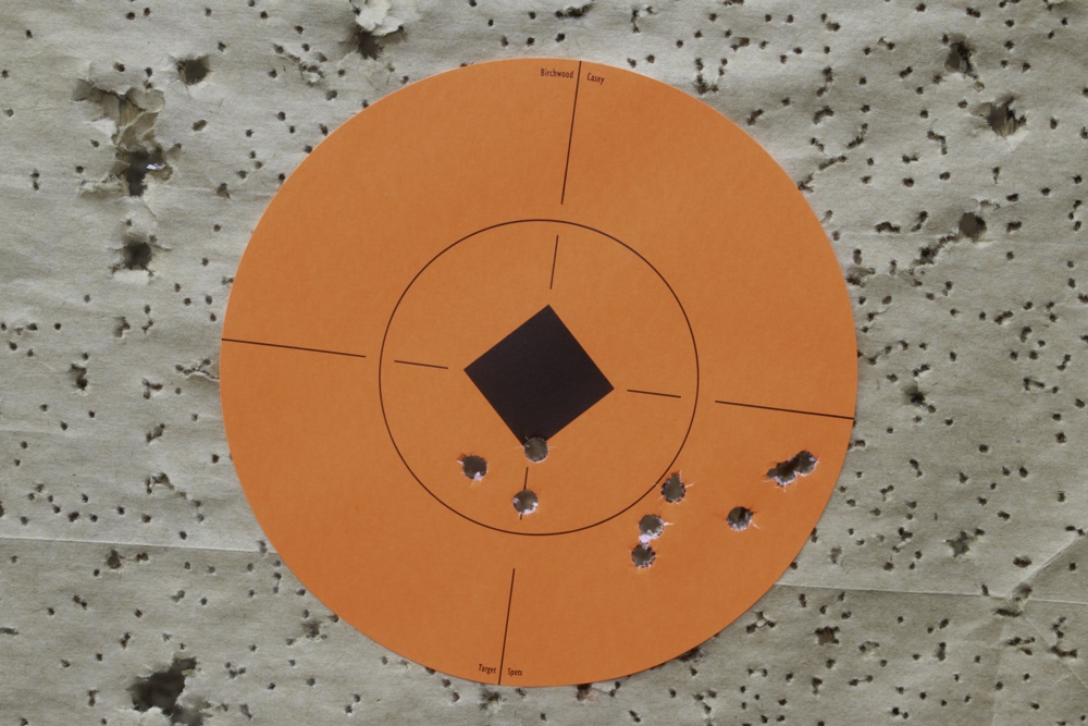 This target includes a trio of 3-shot groups from a benchrest at 50 yards. The two groups on the right were shot with Winchester 100-grain ammo, while the center triangle is from Remington 100-grain rounds.