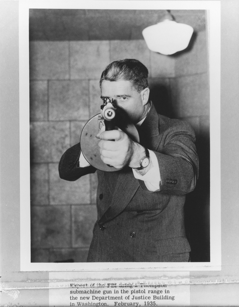 In this posed photo, a special agent holds a Thompson with a 100-round drum magazine in the Justice Department range. The photo is dated February, 1935.