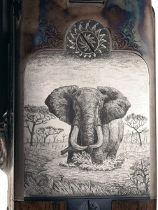 The underside of receiver of the Ken Owen double rifle features one of the most outstanding, and detail rich engraved scenes this writer has ever seen, a large bull elephant walking through the middle of a watering hole.