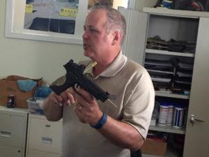 Karl Rehn demonstrates one of the several S&W M&P CORE pistols used in his research, this one mounting Trijicon RMR and suppressor-height BUIS.