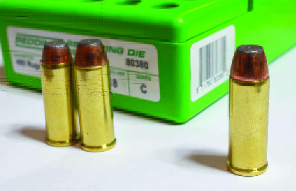Various stages of attaining the balance of seating depth and roll crimp: The two cartridges on the left are no good, while the cartridge on the right has the proper balance. The seating depth allows the roll crimp to fall right into the cannelure of the .480 Ruger bullet.