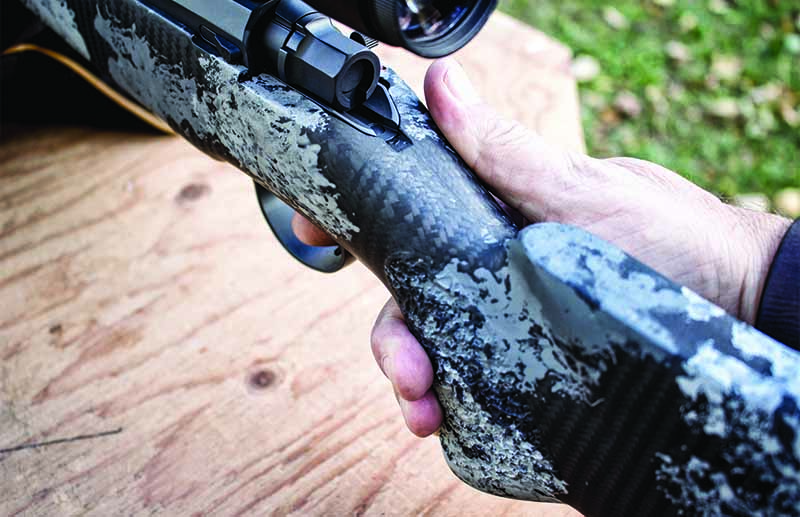 The Nosler stock is assuredly designed for the shooter to keep their thumb on the right side of the stock, gripping the stock rearward with the lower three fingers of the right hand.