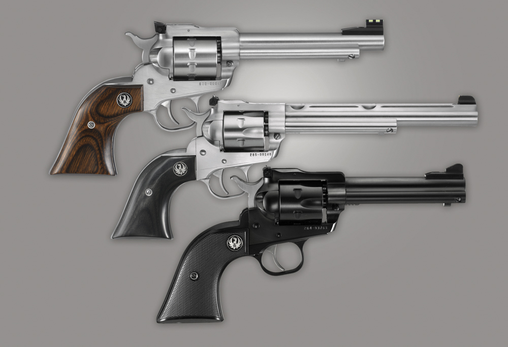 Three New Model rimfires show the different sighting combinations available in current the production guns. At the top, a Single Ten with fiber optic front and adjustable rear sights; center, a Single Six Hunter model with adjustable sights plus integral scope mount bases; and at bottom, a New Model Convertible model with adjustable rear and ramp front sights. Fixed sights are also optional for the Convertible model. 