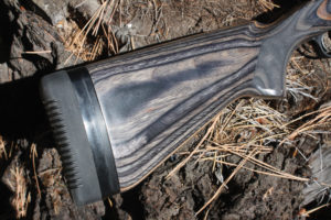 The black laminate stock is rugged and appears to have something of an urban camo appearance. Ruger fits this rifle with a thick recoil pad. Author photo