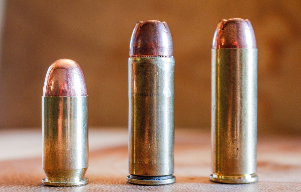 The .45 Colt, center, can use bullets made for the .45 ACP, left. As with any straight-wall cartridge for a revolver, it requires a good roll crimp on the finished cartridge to keep the bullet in place. The same goes for the .454 Casull, right.