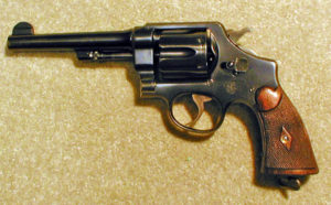 From Gun Digest the Magazine classifieds advertiser www.goodmanguns.com is this 1917 .45ACP PRE-WORLD WAR II REVOLVER, #177XXX, MADE CIRCA 1930, all matching numbers including the diamond checkered grips, shows exc. original blue with just the back strap showing wear to gray/brown, exc. blue on the butt and front strap which shows just some minor thinning near the butt, exc. barrel and cylinder blue with minor edge wear only, nice frame blue with a couple spots of holster wear on right side just ahead of grips and a little on the top strap, exc. grips with the right side bottom showing a little very worn in shallow chipping to the extreme edge only, lanyard ring intact, fine case color on hammer and trigger, exc. mech and bore, front sight has not been altered or filed, even the front of the cylinder shows good blue which indicates this revolver was rarely if ever shot, few made and hard to find big "N" frame variation, $1195