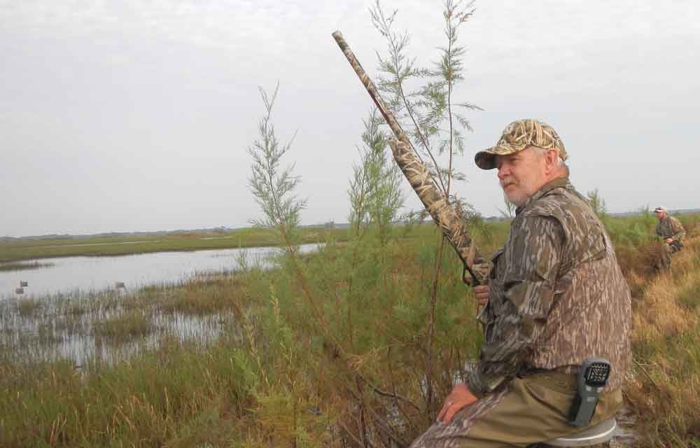 With Winchester SX4 shotguns ready, the author and, in the background, Rafe Nielsen, wait for teal on a Ducks Unlimited wetland project near Matagorda, Texas.