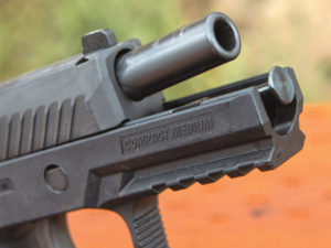 Standard and threaded barrels are available for the P320C. Disassembly is easy and safe as you cannot turn the takedown lever with a magazine in the pistol. Author photo