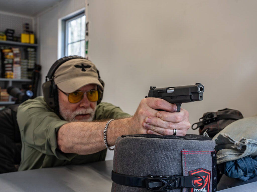 The Springfield SA-35 4-Inch being shot from a bench.