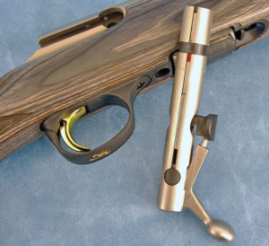 The Browning T-Bolt employs a unique locking system. Two holes at either side of the receiver serve as abutments for the circular locking lugs.