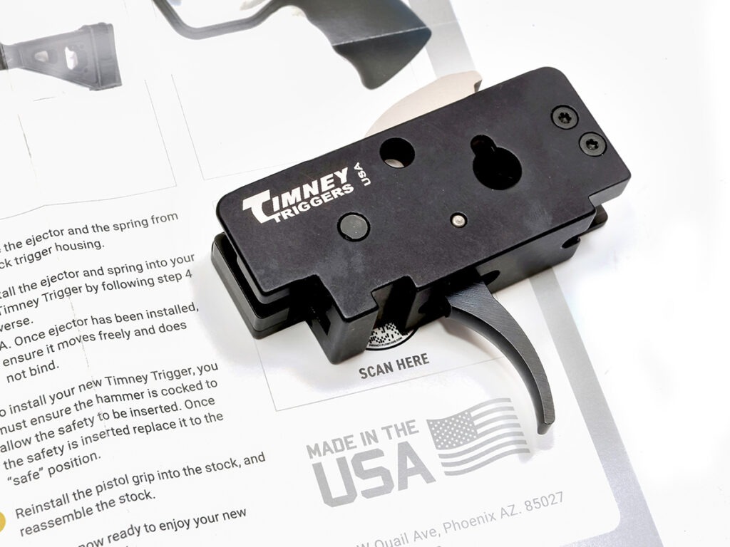 The Timney HK MP5 Trigger laying on top of the installation instructions.