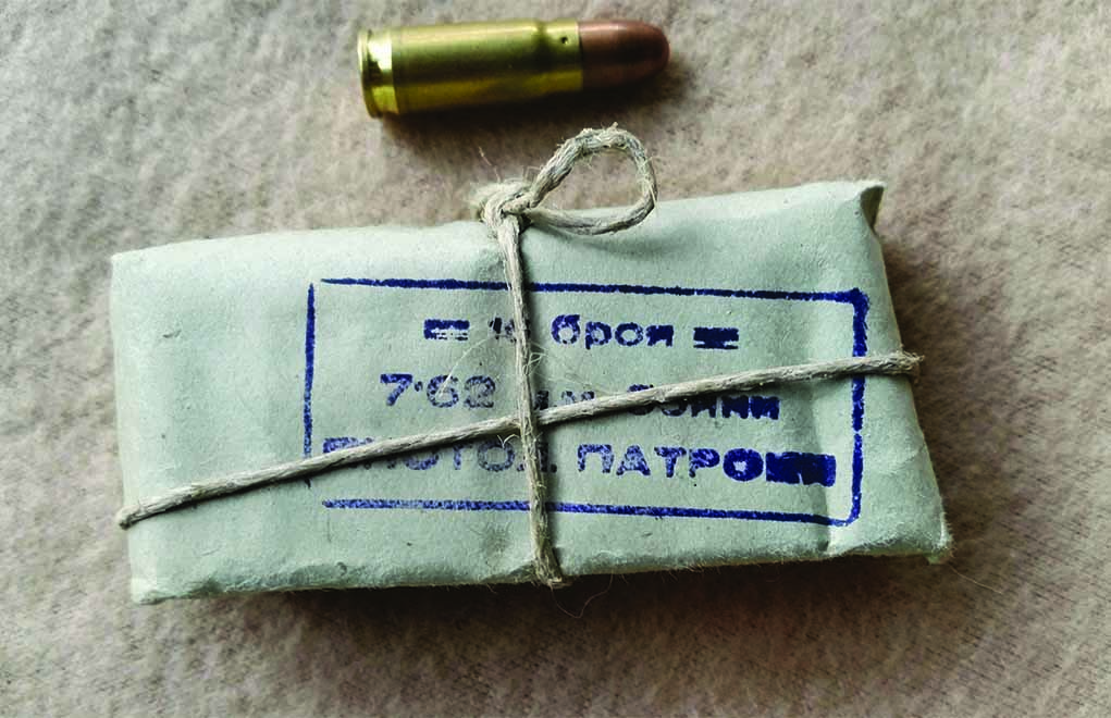 At right is the Polish-made 7.62 Tokarev ammunition that is still for sale at various times. The string-tied, blue-paper wrapped Bulgarian surplus ammo is presently available in large quantities. It is sold in either the 16-round pack as shown, or in sealed zinc cans of 440 or 600 rounds. 
