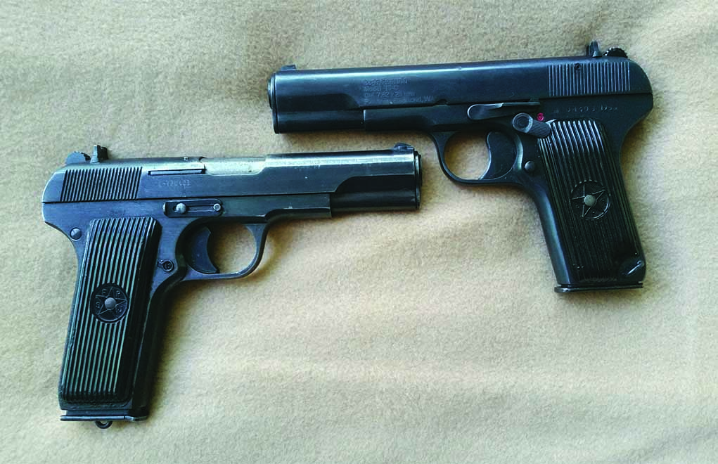 Shown here is the Romanian TTC and the Yugoslavian M-57 copy of the Russian Tokarev. It can be seen that physically the two differ primarily with the longer grip of the latter, which accepts a nine-round magazine in lieu of the standard Tokarev’s eight. Romanian TTC pistols were for the most part refinished prior to export, and the majority of the M-57 variety were imported in “as is” condition. Note the added thumb safety on the Romanian example – a feature demanded by the BATFE prior to import of any pistol of the Tokarev design. The M-57 is equipped with a far more cosmetically pleasing sliding safety adjacent to the left frame. 
