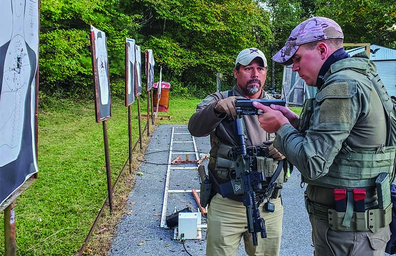 (Below) David “Boon” Benton working on the range with a member of a police SWAT team. Boon travels all across the United States offering his training services.