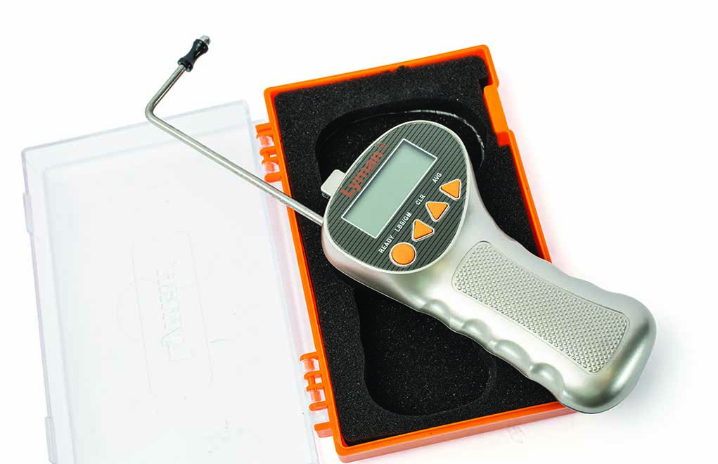 The Lyman trigger pull gauge—complete with its hard case and the measuring rod extended.