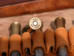 Ball ammo is best for survival guns. Choose brass cases.