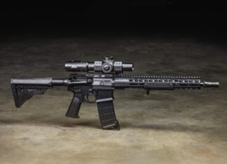 Griffin Armament: Behind The Brand A Griffin Armament AR-15 equipped with Griffin Armament accessories sitting on a concrete floor.