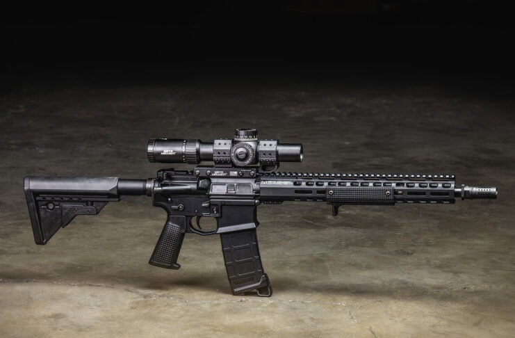 Griffin Armament: Behind The Brand A Griffin Armament AR-15 equipped with Griffin Armament accessories sitting on a concrete floor.