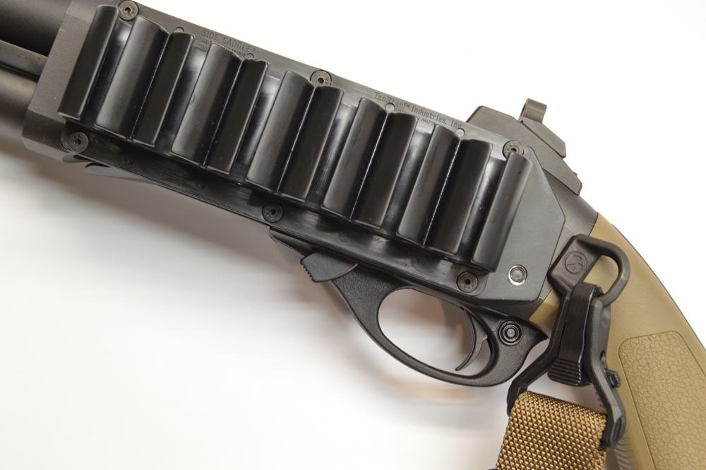The sidesaddle shell carrier, ghost ring rear sight, and Magpul sling attachment are essential Model 870 upgrades. 
