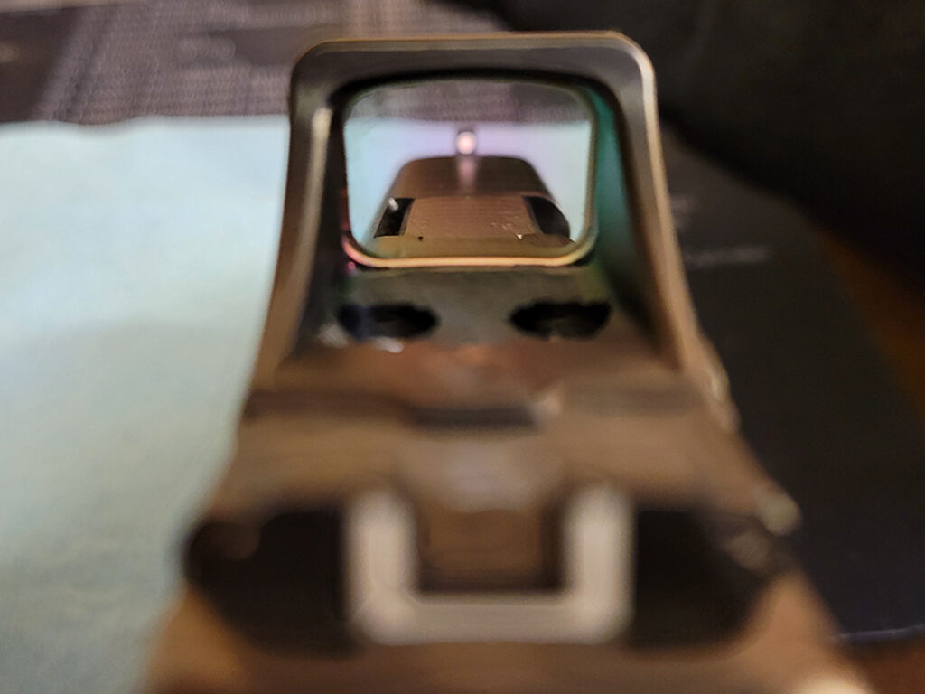 The Holosun SCS red dot lens after being cleaned.