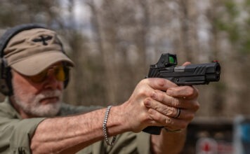 Irons Vs. Red Dots For Carry Pistols: Which Is Better? irons vs red dots aiming 1