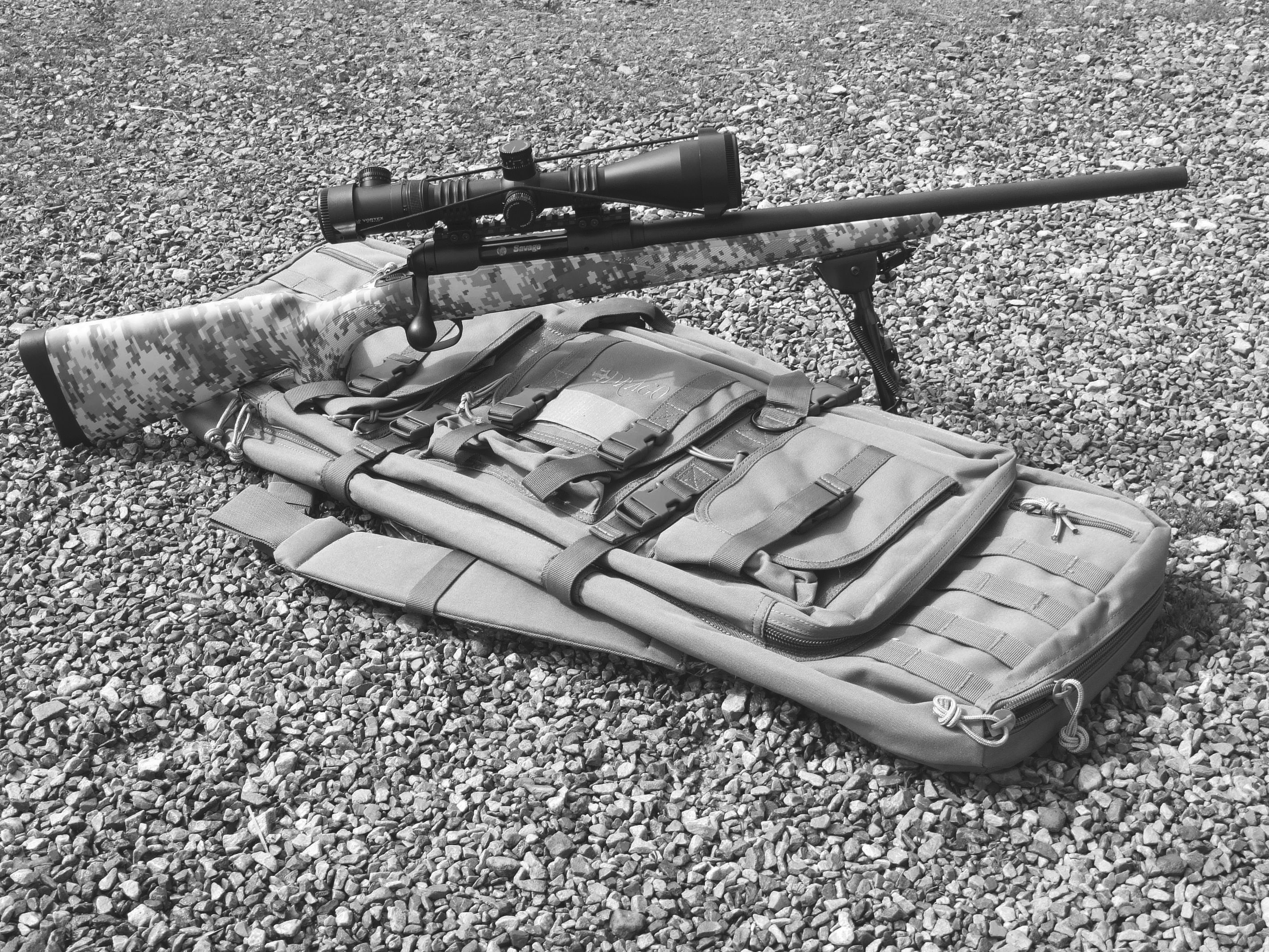 The Savage 110 Tactical .308 Carbine is a five-shot bolt gun that would do for long-range defense, though it is limited in capacity and speed. Factory equipped with an Army Digital Camo stock, the Carbine is shown with a Vortex scope and bipod. The tactical carbine is lighter than many sniper rifles currently available.